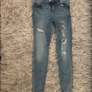 ripped american eagle low rise jeans